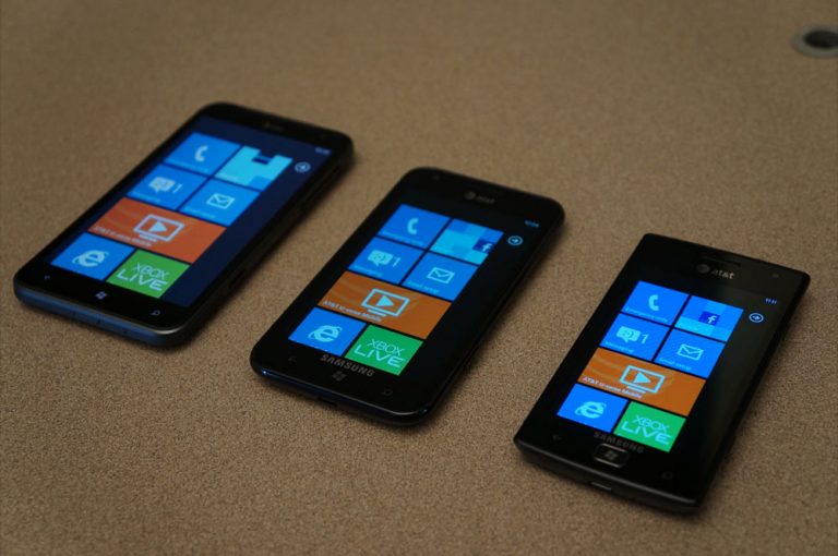 From left, the new HTC Titan, the Samsung Focus S, and the Samsung Focus Flash introduced by Windows Phone President Andy Lees at the All Things D Asia conference on Oct. 19, 2011.