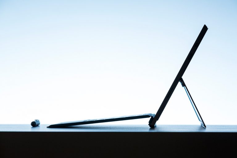 The stunningly thin and beautifully designed Surface Pro 3 with the Surface Pro Type Cover attached. To the left is the custom Surface Pen, crafted with a solid, polished aluminum finish, and designed to look and feel like an actual fountain pen to give you a natural writing experience.
