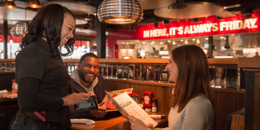 Wait staff at TGI Fridays are taking orders with tablets, improving the way they interact with customers.