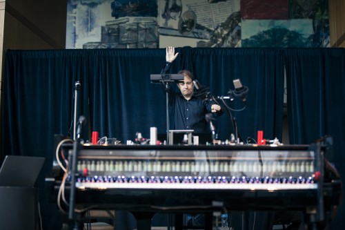 Seattle Symphony Music Director Ludovic Morlot practicing the gestures that control the kinetic instruments during a dress rehearsal for “Above, Below and In Between.”