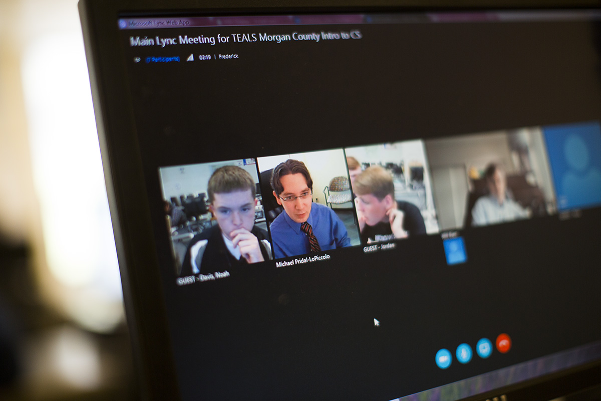 TEALS volunteer teacher Michael Pridal-LoPiccolo of Microsoft, second from left on the screen, during a session with students in Morgan County, Kentucky. Photo by Mike Kane.