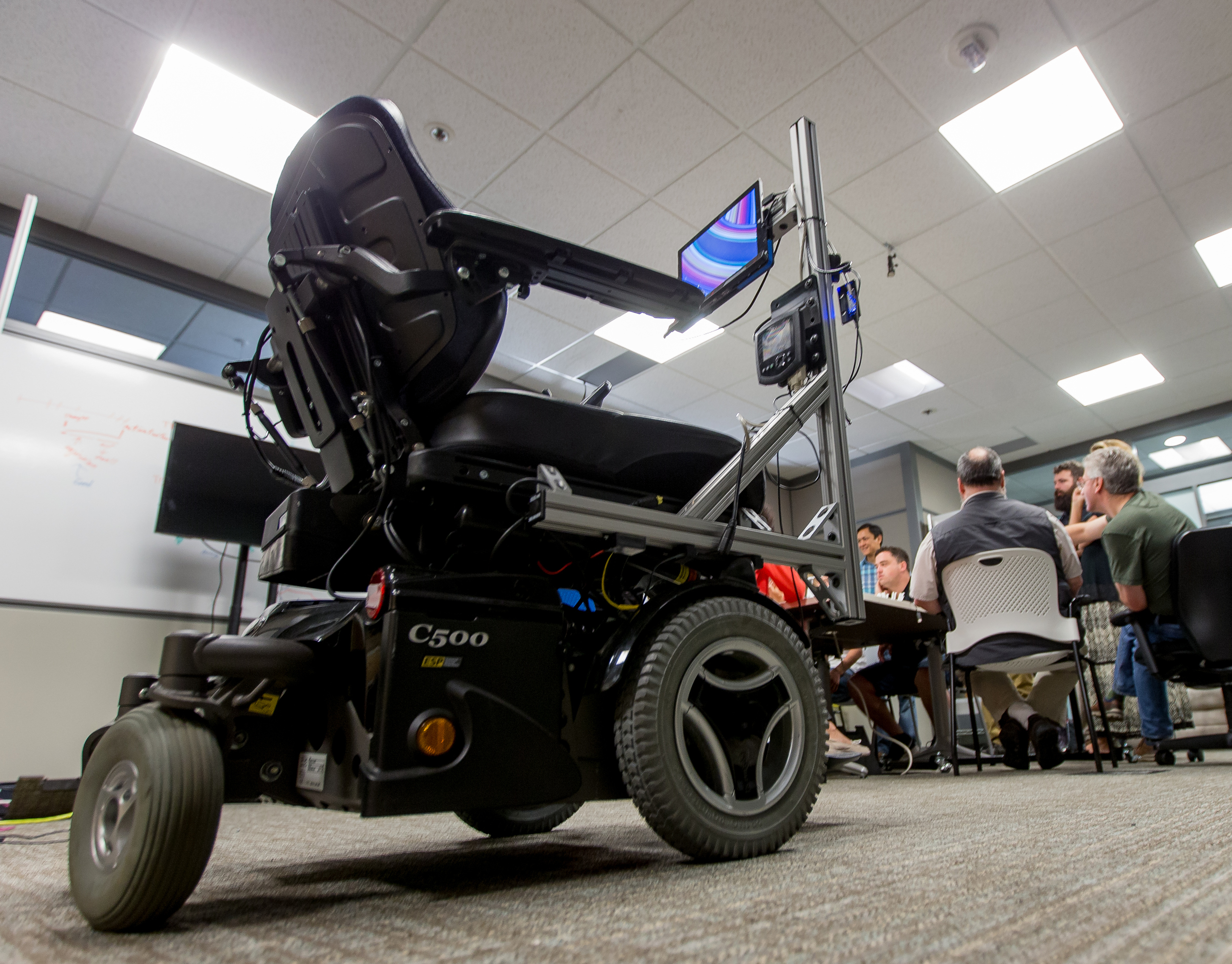 The Eye Gaze Wheelchair tracks users’ eye movements as they look at controls on a Surface tablet, allowing them to drive it using only their eyes. (Photo by Scott Eklund/Red Box Pictures)