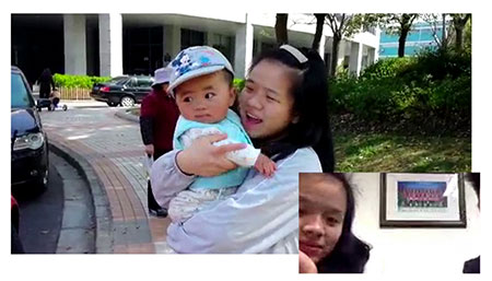 During a video interview, Xing Le gazes at a photo being shown of her with her son. 