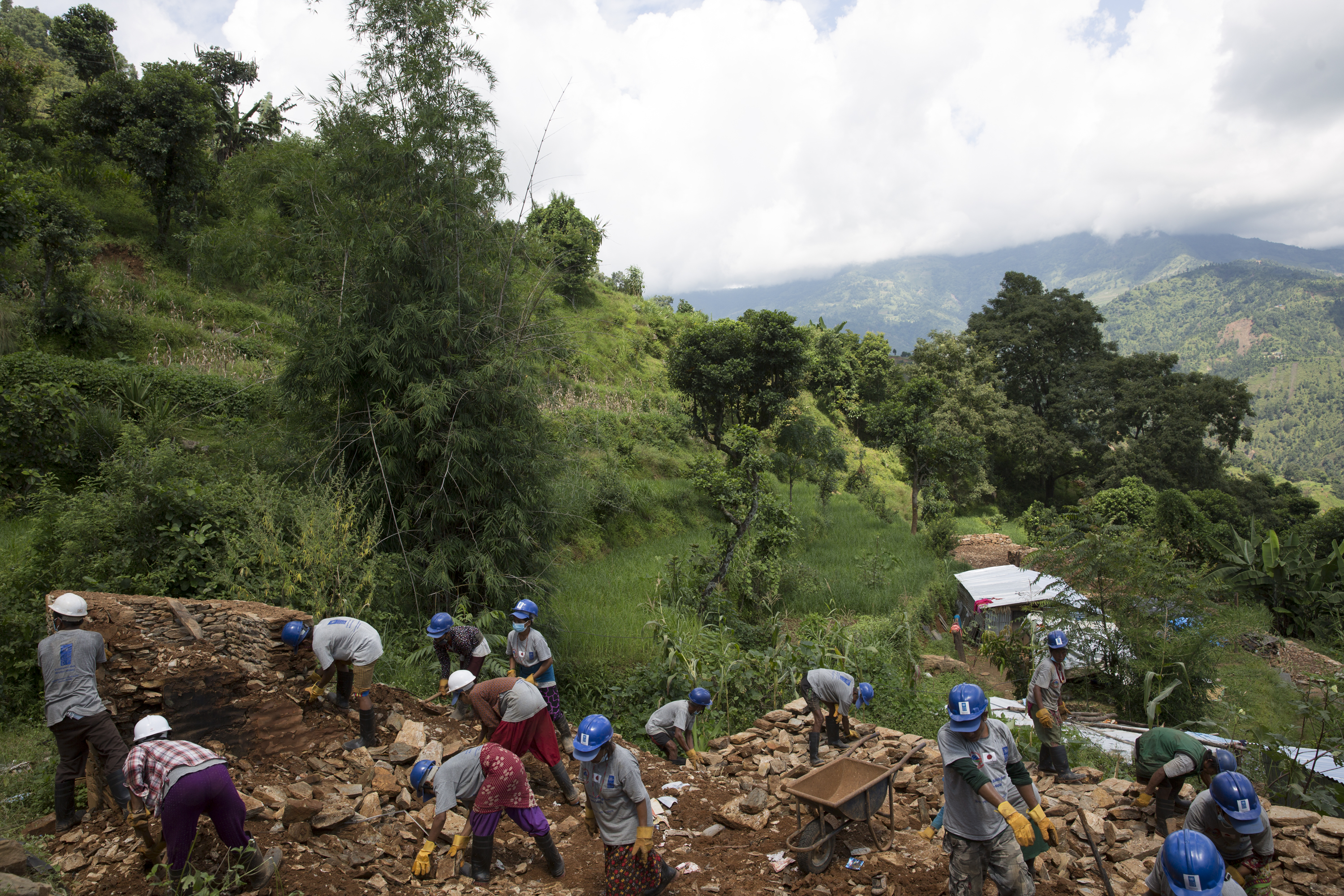 Workers clear debris from the earthquake that destroyed or severely damaged upwards of 600,000 houses and other buildings in Nepal.