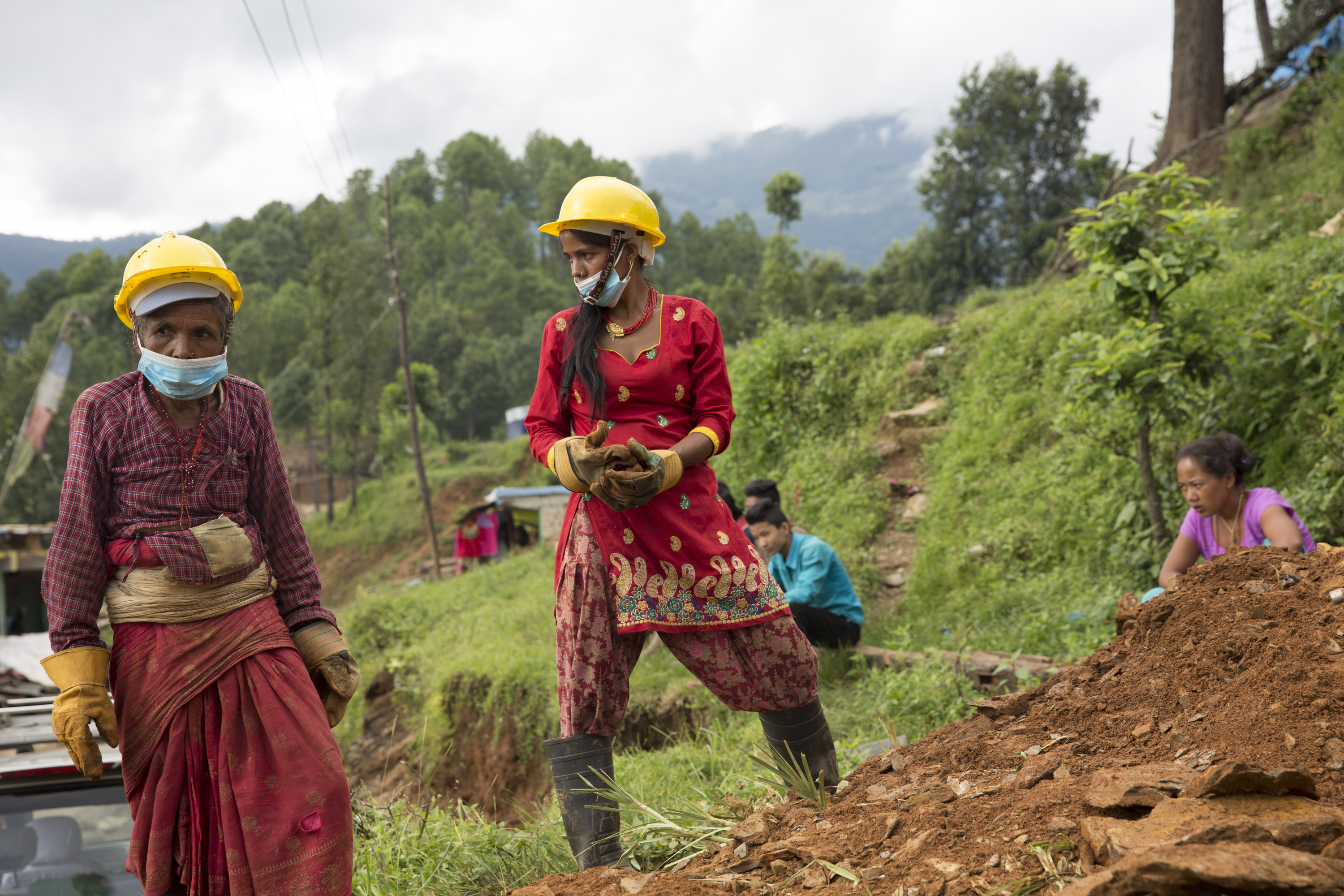 Emergency Employment Program (EEP) workers remove debris from a collapsed building in the Sindhupalchowk District.