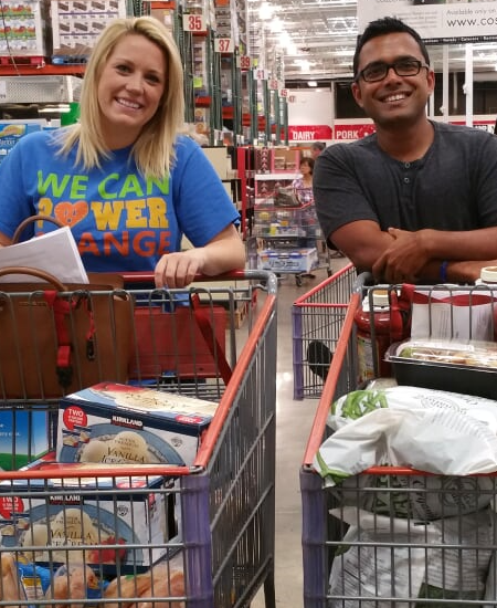 Loaned professionals Jennifer Emkjer and Suveen Reddy shop for food to prepare and serve to more than 150 people at Ronald McDonald House.
