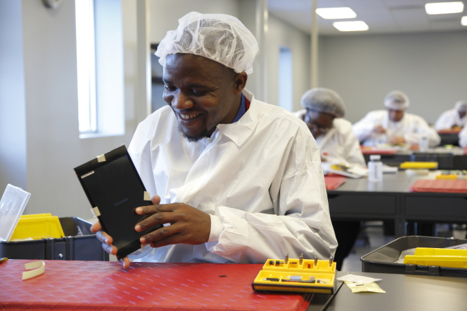 Operator Salah Macheremo, a native of Kenya, in the BAK USA clean room in Buffalo, New York.