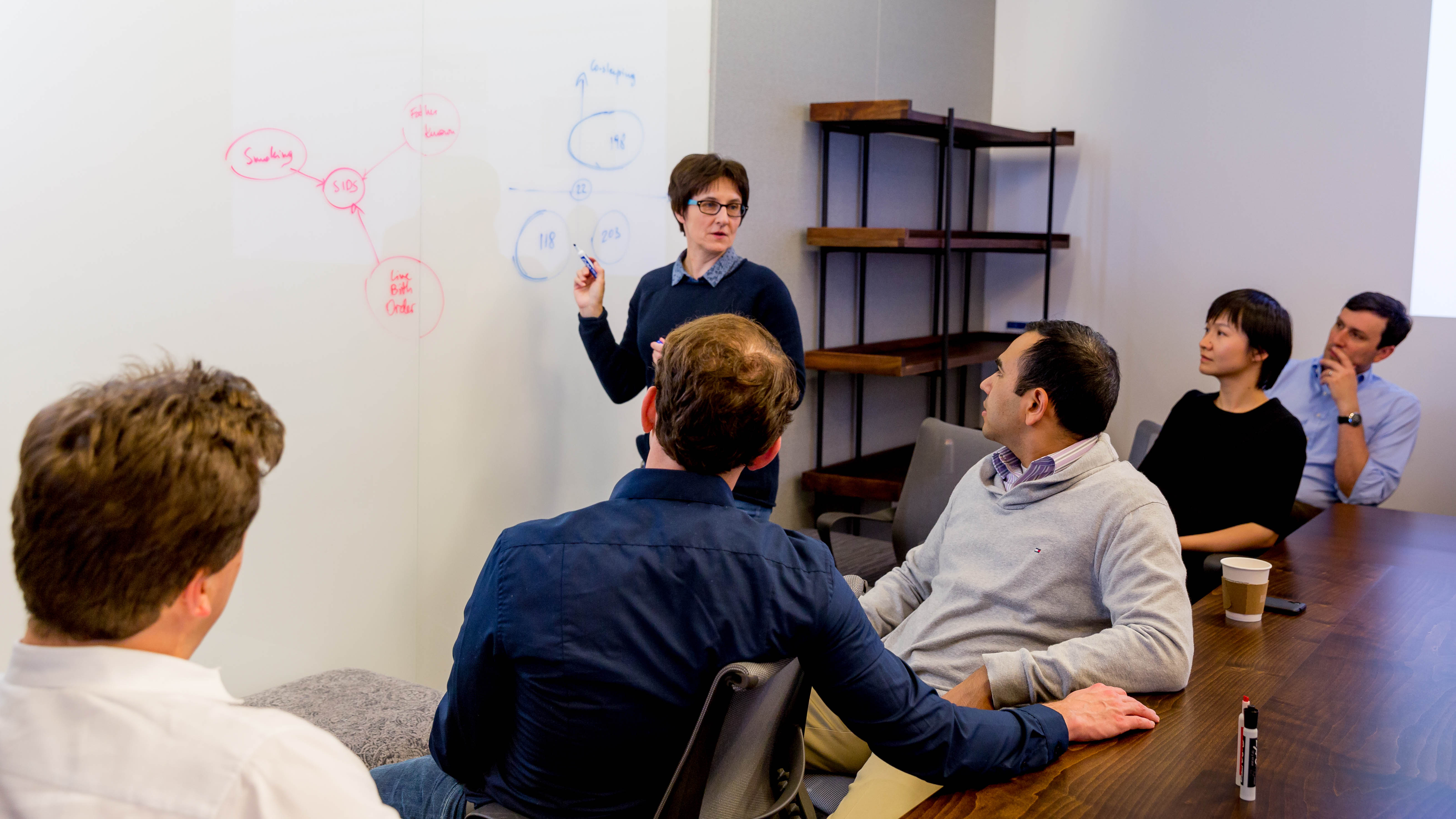 Urszula Chajewska, Microsoft principal data and applied scientist, shown at a whiteboard