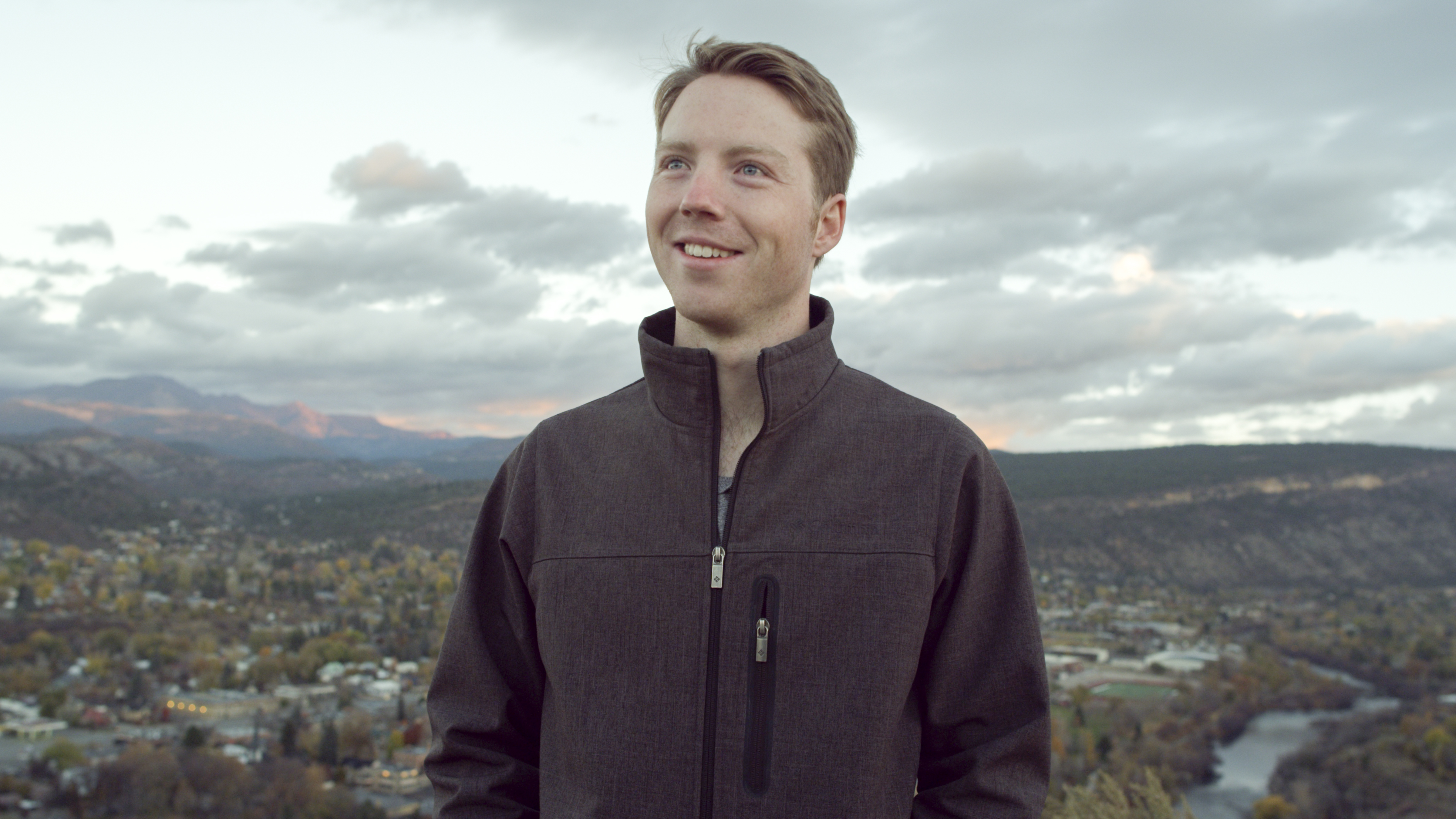 Easton LaChappelle standing on a hill above the Colorado town he grew up in.