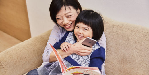 Young daughter in mother’s lap
