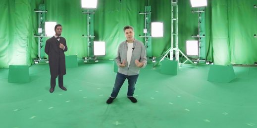 Two men standing in a green room