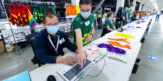 Two men wearing masks at event