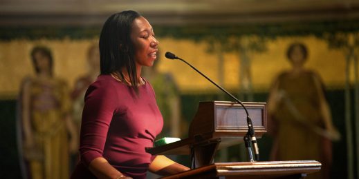 Angela Winfield speaks into a microphone