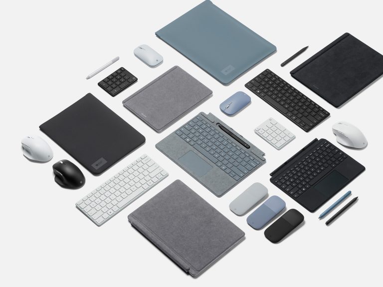 An aerial view of Surface Pro 8 devices with accessories