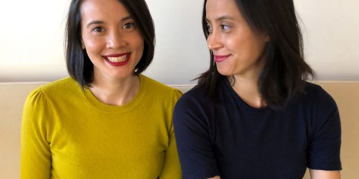 Two women sitting next to each other