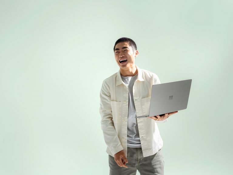 Man holding Surface Laptop Go 2
