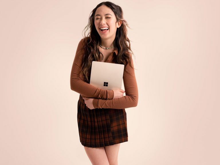 Woman holding Surface Laptop Go 2