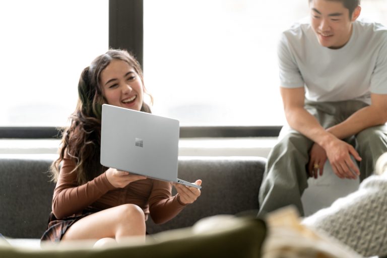 Woman holding Surface Laptop Go 2
