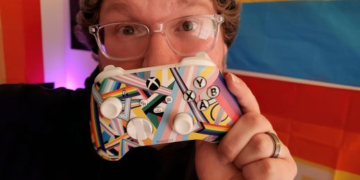 Man holds the Xbox Pride controller