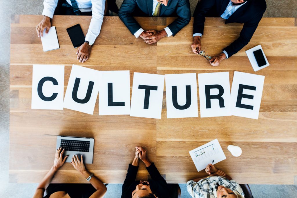 Business meeting with word Culture on table