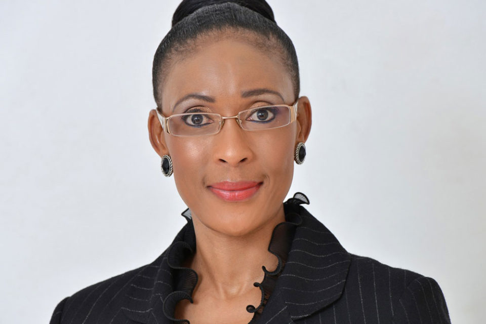 Female wearing spectacles dressed in black
