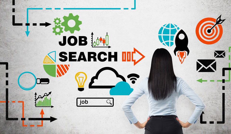 A female facing a wall and looking at a graphic demonstrating job search path.