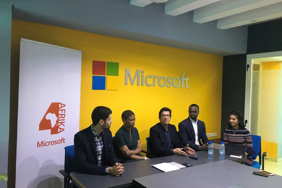 Group of African business executives sitting around a boardroom table