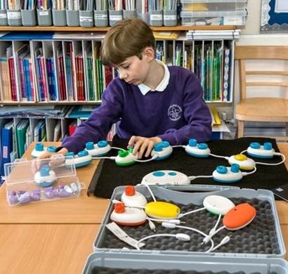 young boy learning using accessibility tools