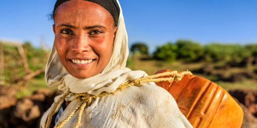 African woman carrying water
