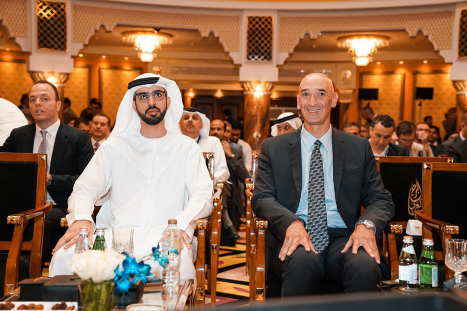 Arab men seated in a room.