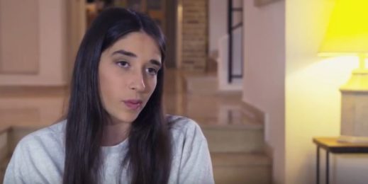 young lady speaking in front camera