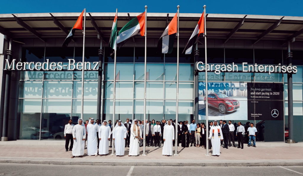 Team photo outside Mercedez Benz Gargash dealership.