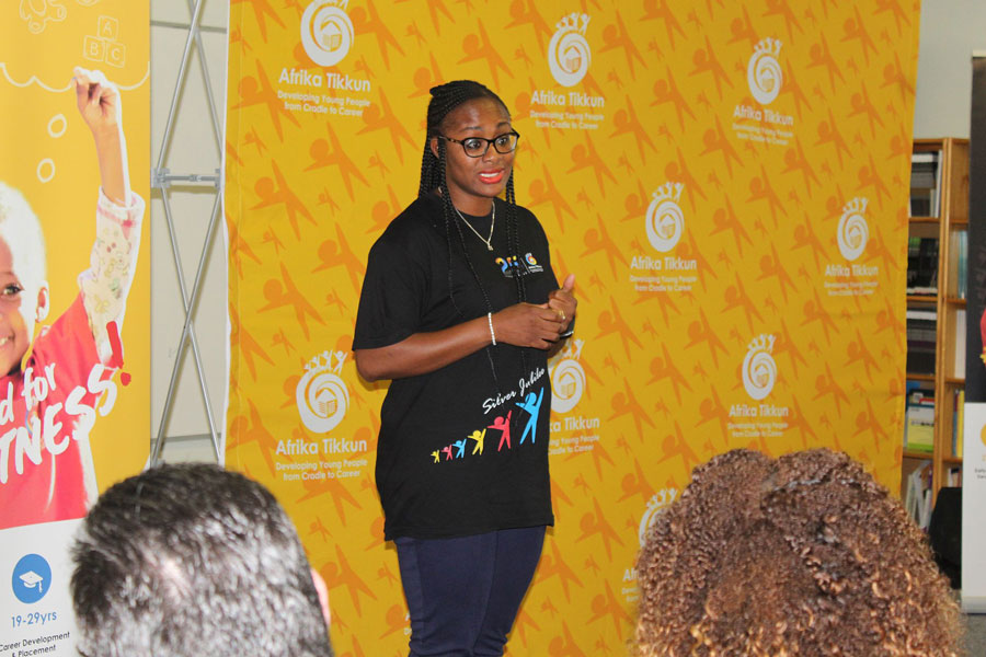 Lady standing and addressing an audience