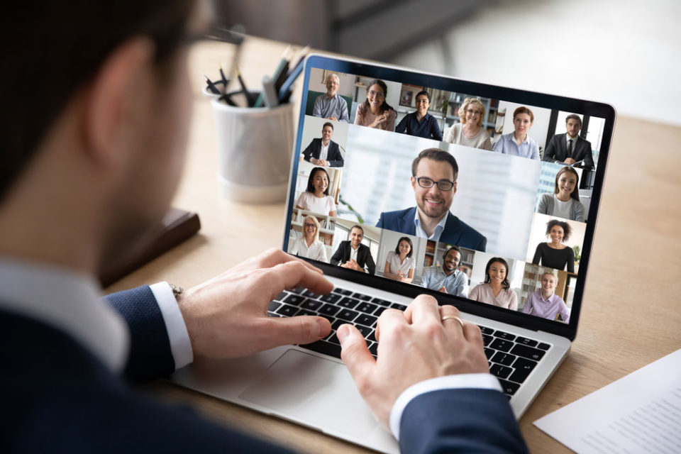 A businessman conducting a conference meeting on the web.