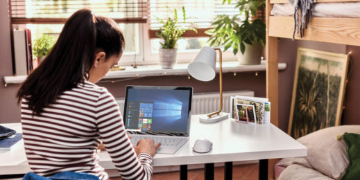 Young female student works from home using Microsoft technology.