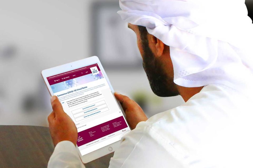 A picture of a person looking at a tablet