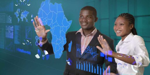 A man and a woman looking at a map of Africa surrounded by numbers and graphs.