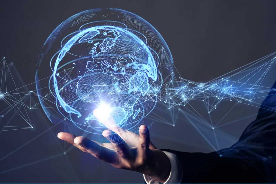 Man holds holographic image of Earth.