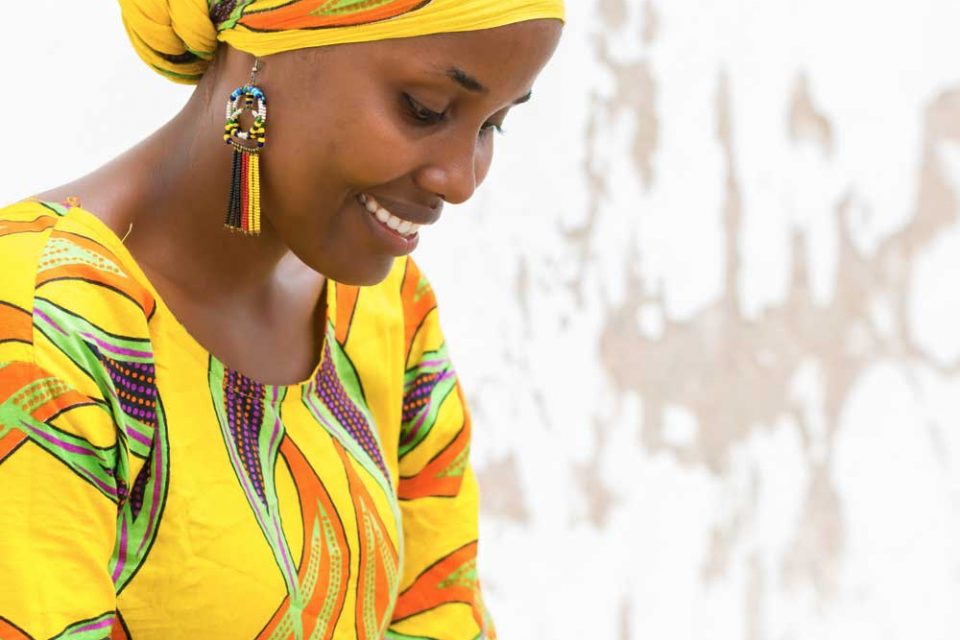 African woman using a smartphone.