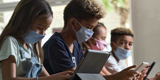 A school class using technology to learn during the pandemic.