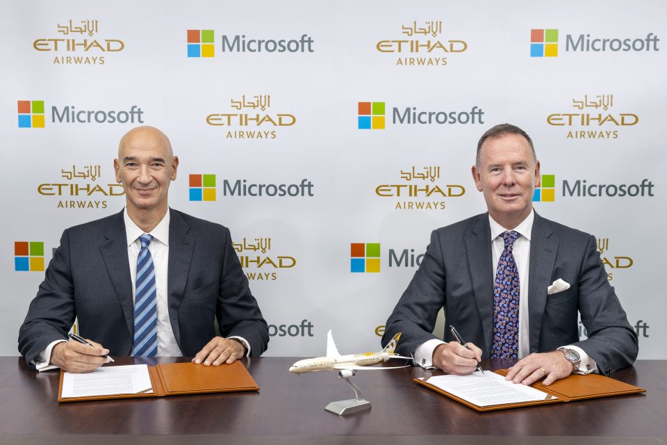 Two company spokesperson signing a MOU
