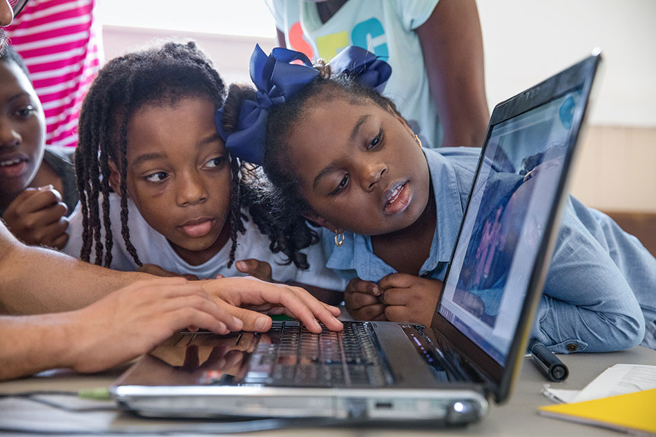 Youth mentor and students collaborate on performance piece