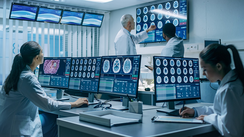 A team of healthcare specialists analyze data from different digital screens
