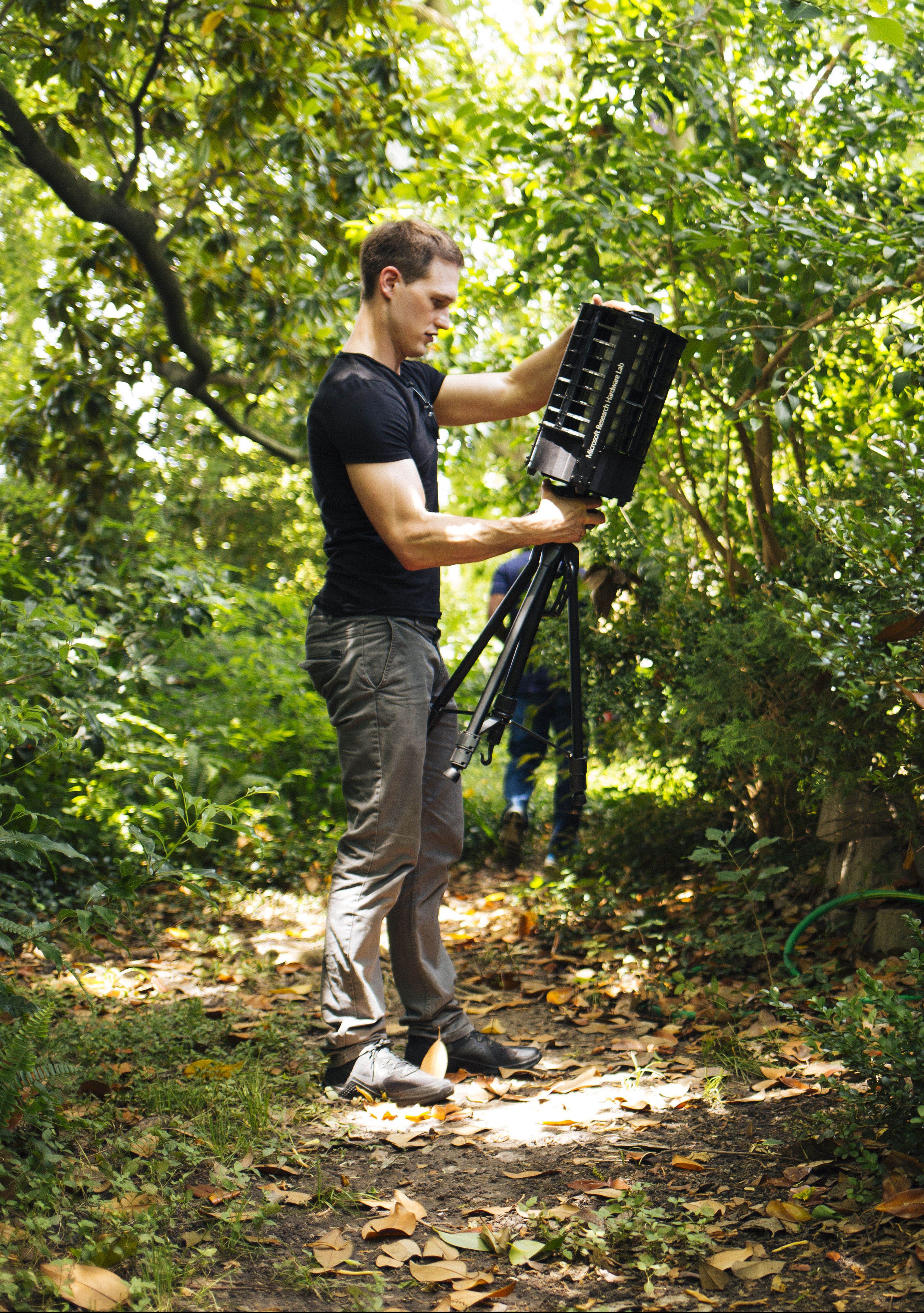 Photo of man checking robotic trap