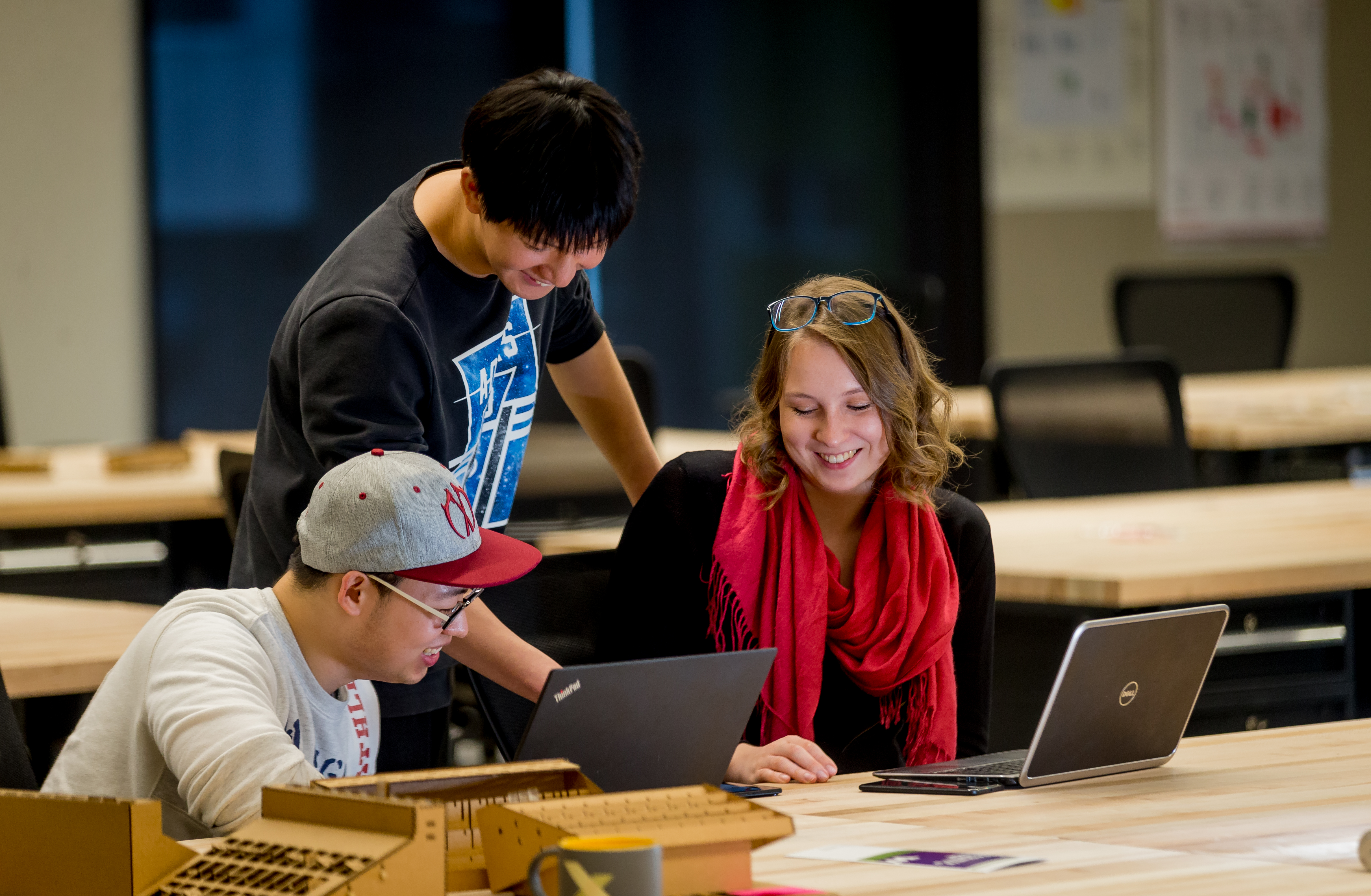 Students view a laptop