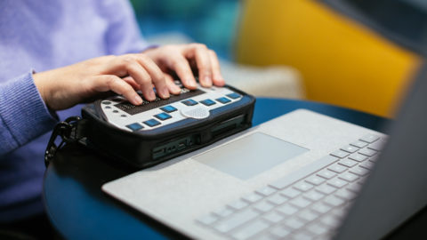 a woman uses an accessibility device