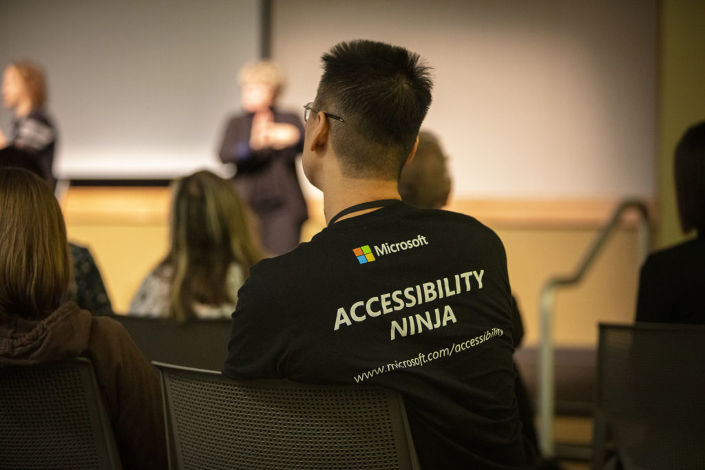 man from behind wearing accessibility ninja t-shirt