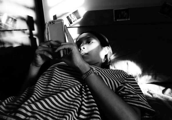 Reading smartphone in bed