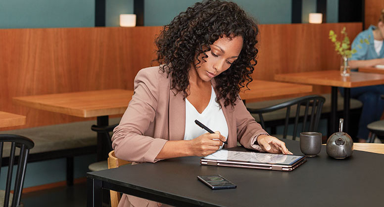 A woman works on a tablet