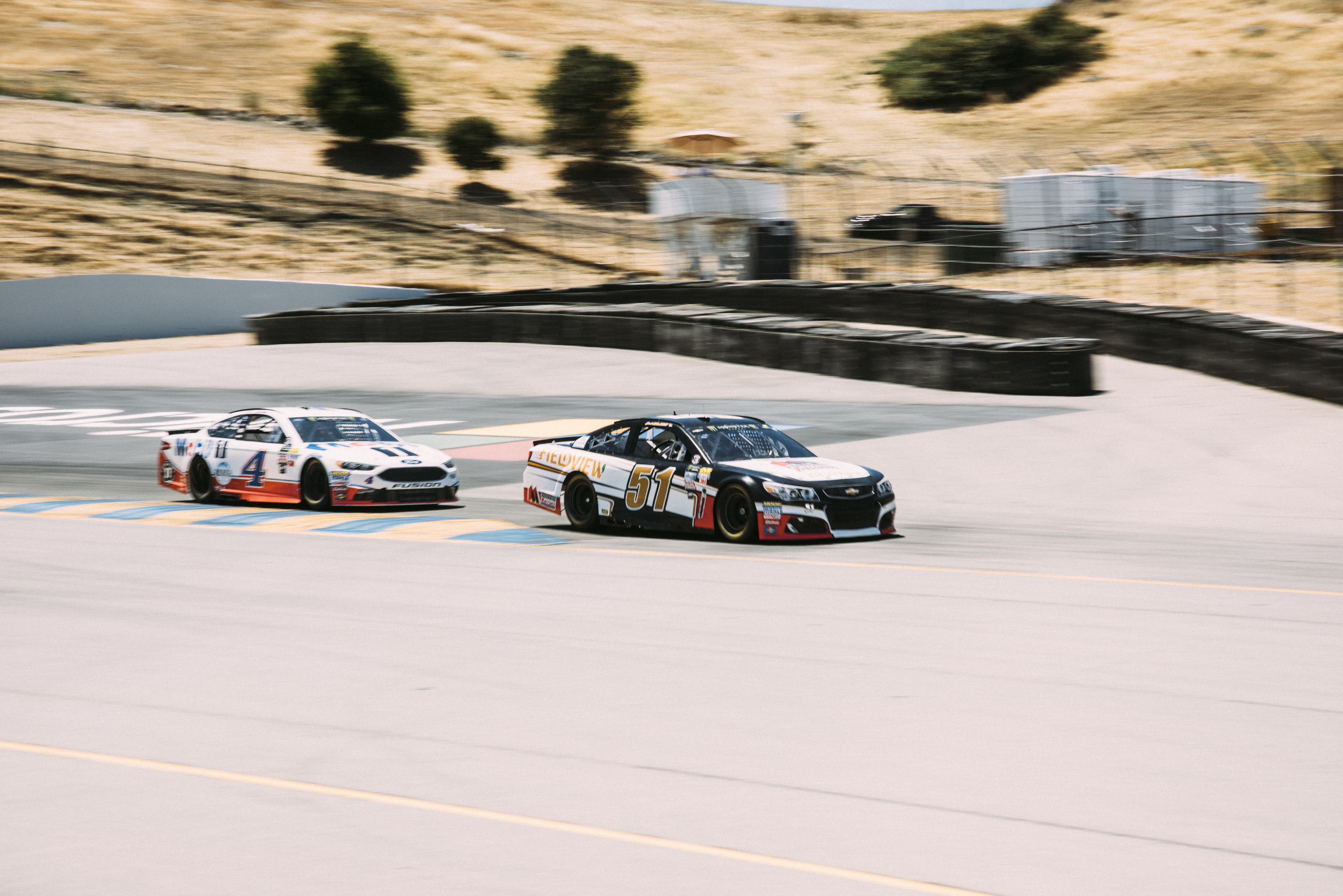 Kevin Harvick (No. 4) and Josh Bilicki (No. 51) at Sonoma Raceway. (Image courtesy of Integrated Talent)